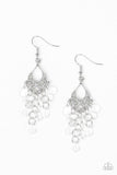 Glassy white teardrops cascade from an ornate silver frame, creating a dainty lure. Earring attaches to a standard fishhook fitting. Sold as one pair of earrings.  P5WH-WTXX-168XX