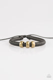 Shiny black twine wraps around a black cord, creating an urban look around the wrist. Shiny brass beads slide along the cording for a rugged finish. Features an adjustable sliding knot closure.  P9UR-BKXX-242PU