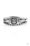 Serrated and studded gunmetal bands flank a glistening band featuring an airy square centerpiece for a casual look. Features a dainty stretchy band for a flexible fit. Sold as one individual ring. P4DA-BKXX-054XX