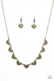 Heart-shaped filigree dances along the centers of shimmery brass heart frames. The airy frames delicately connect below the collar for a chic finish. Features an adjustable clasp closure. Sold as one individual necklace. Includes one pair of matching earrings.  P2WH-BRXX-114XX