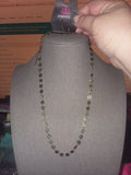 Brushed in an antiqued finish, flat brass discs link below the collar in an undeniably shimmery fashion. Features an adjustable clasp closure. Sold as one individual necklace. Includes one pair of matching earrings.  P2WH-BRXX-104LJ