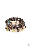 A mismatched collection of brown wooden beads, silver accents, turquoise stones, and glassy yellow beads are threaded along stretchy bands, creating colorful layers around the wrist. Sold as one set of three bracelets.  P9SE-YWXX-136XX