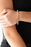 Infused with dainty gold accents, a collection of colorful natural stones are threaded along a stretchy band. A glistening gold frame engraved with the word, "blessed" adorns the center for a seasonal finish. Sold as one individual bracelet. P9SE-URGD-031XX