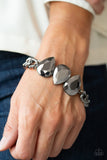 Three oversized hematite teardrop gems join at the center of a dramatic gunmetal chain, creating a jaw-dropping display across the wrist. Features an adjustable clasp closure. Sold as one individual bracelet. P9ED-BKXX-073XX