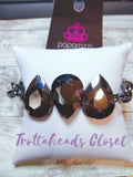 Three oversized hematite teardrop gems join at the center of a dramatic gunmetal chain, creating a jaw-dropping display across the wrist. Features an adjustable clasp closure. Sold as one individual bracelet. P9ED-BKXX-073XX