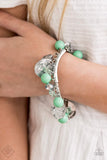"Charming Treasure" (P9WH-GRXX-154TC)  Sections of hammered silver discs, green crystals, polished Biscay Green beads, and metal flecked crystal-like teardrops dangle from curved silver bars that have been threaded along a stretchy band that wraps around the wrist, creating a shimmering fringe. Sold as one individual bracelet.