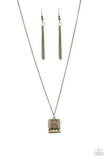 A filigree filled brass frame is pressed into a larger hammered frame, creating a dainty pendant below the collar. Features an adjustable clasp closure. Sold as one individual necklace. Includes one pair of matching earrings. P2DA-BRXX-120XX