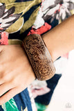 2019 March Fashion Fix - Sunset Sightings A thick wooden bangle is etched in intricate floral patterns, creating an irresistibly laid-back statement piece. Sold as one individual bracelet. P9SE-BNXX-113MA