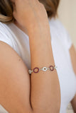 A series of red and white rhinestone encrusted silver frames link across the wrist, creating a bubbly sparkle. Features an adjustable clasp closure. Sold as one individual bracelet. P9RE-RDXX-107XX