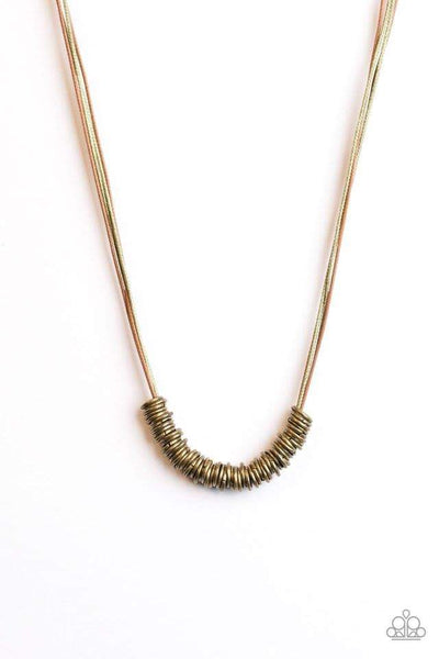Timeless brass rings are threaded along shiny cording, creating an urban look below the collar. Features a clasp closure. Sold as one individual necklace.  *** No earrings included ***  P2UR-BRXX-020XX