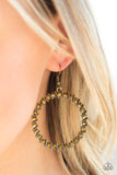 A collection of glittery aurum rhinestones and slanted brass frames coalesce into a sparkling hoop. Earring attaches to a standard fishhook fitting. Sold as one pair of earrings.  P5ED-BRXX-052XX