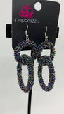 2021 Empower Me Pink Exclusive A dainty collection of iridescent oil spill seed beads adorns two interlocking hoops, creating a colorfully stacked lure. Earring attaches to a standard fishhook fitting. Sold as one pair of earrings.   P5ST-MTXX-035XX
