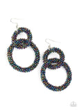 2021 Empower Me Pink Exclusive A dainty collection of iridescent oil spill seed beads adorns two interlocking hoops, creating a colorfully stacked lure. Earring attaches to a standard fishhook fitting. Sold as one pair of earrings.   P5ST-MTXX-035XX