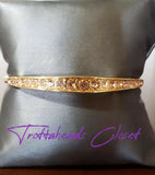 2020 March Fashion Fix Exclusive Gradually increasing in size at the center, two sections of peach rhinestones are encrusted along a dainty gold bangle rippling with wavy textures for a timeless twist. Sold as one individual bracelet.  P9RE-GDXX-183XX