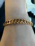 Etched in shimmery textures, glistening gold links join across the wrist, creating a bold bangle.   P9IN-GDXX-082XX