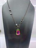 2020 Life of the Party Black Diamond Bring Back Piece A trio of faceted hematite crystal-like beads asymmetrically trickle along a mismatched gunmetal chain. Featuring a regal emerald-cut, an oversized rainbow gem swings from the bottom of the gunmetal chain for a glamorous finish. Features an adjustable clasp closure. Sold as one individual necklace. Includes one pair of matching earrings. P2SE-MTXX-176XX