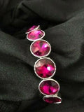 2020 Black Diamond Bring Back Piece  Faceted pink gems are pressed into sleek silver frames. The glittery frames are threaded along elastic stretchy bands, creating a glamorous look around the wrist. Sold as one individual bracelet.  This Fan Favorite is back in the spotlight at the request of our 2020 Life of the Party member with Black Diamond Access, Marissa K.  P9RE-PKXX-113XX