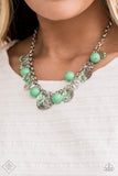 "Prismatic Sheen" (P2ST-GRXX-066TC)  A shimmery collection of hammered silver discs, green crystals, polished Biscay Green beads, and metal flecked crystal-like teardrops dangle from the bottom of silver chain, creating a whimsical fringe below the collar. Features an adjustable clasp closure. Sold as one individual necklace. Includes one pair of matching earrings.