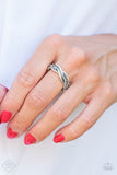 "Texture Tango" (P4IN-SVXX-088HD)  Featuring mismatched textures, ribbons of antiqued silver bands braid across the finger for a tribal inspired look. Features a dainty stretchy band. Sold as one individual ring.