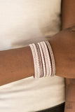 Shiny silver studs and rows of smoky and glittery white rhinestones are encrusted along strips of purple suede, creating sassy shimmer around the wrist. Features an adjustable snap closure. Sold as one individual bracelet.   P9DI-URPR-023XX