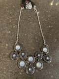 2020 April Life Of The Party Exclusive A collection of opalescent white gems dot the centers of studded silver frames that connect into a starry centerpiece below the collar. Features an adjustable clasp closure. Sold as one individual necklace. Includes one pair of matching earrings.  P2ST-WTXX-062XX
