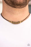 Stamped in tribal inspired patterns, antiqued brass accents and mismatched brass beads slide along a brown cord, creating an urban look below the collar. Features a button loop closure. Sold as one individual necklace. P2UR-BRXX-023XX