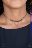 Dainty gunmetal rings swing from a dainty gunmetal chain, creating a flirtatious fringe. Features an adjustable clasp closure. Sold as one individual choker necklace. Includes one pair of matching earrings.  P2CH-BKXX-053XX