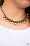 Featuring a glassy shimmer, brass cube beads swing from the tops of tilted square frames, creating a fierce geometric fringe below the collar. Features an adjustable clasp closure. Sold as one individual necklace. Includes one pair of matching earrings.  P2RE-BRXX-157XX