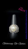2019 August Life Of The Party Exclusive  A pearly white bead is pressed into the center of a bold silver band radiating with countless white rhinestones, creating a dramatic statement piece atop the finger. Features a stretchy band for a flexible fit. Sold as one individual ring.  P4RE-WTXX-330XX