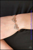 Featuring filigree-filled centers, glistening copper heart frames connect around the wrist in a romantic fashion. Features an adjustable clasp closure. Sold as one individual bracelet.  Get The Complete Look! Necklace: "Heart Heaven - Copper" (Sold Separately)  P9WH-CPXX-100VG