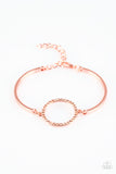 Encrusted in glittery peach rhinestones, a circular frame attaches to two shiny copper bars, creating a refined centerpiece. Features an adjustable clasp closure. Sold as one individual bracelet.  P9RE-CPSH-087XX
