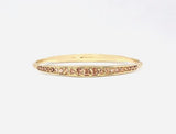 2020 March Fashion Fix Exclusive Gradually increasing in size at the center, two sections of peach rhinestones are encrusted along a dainty gold bangle rippling with wavy textures for a timeless twist. Sold as one individual bracelet.  P9RE-GDXX-183XX