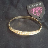2020 March Fashion Fix Exclusive Gradually increasing in size at the center, two sections of peach rhinestones are encrusted along a dainty gold bangle rippling with wavy textures for a timeless twist. Sold as one individual bracelet.  P9RE-GDXX-183XX