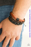 A mishmash of black braided twine and leather and strands of shiny brown leather cording layer across the wrist. A strand of wooden beads is added to the urban palette for an earthy finish. Features an adjustable sliding knot closure. Sold as one individual bracelet. P9UR-BNXX-286XX