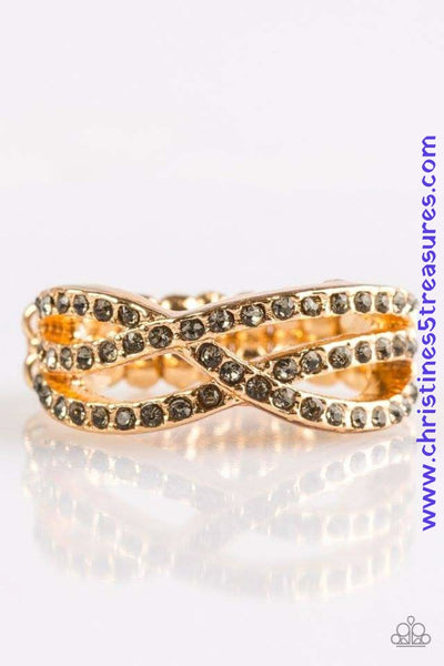 Encrusted in glittery smoky rhinestones, shimmery ribbons of gold crisscross across the finger in a timeless fashion. Features a dainty stretchy band for a flexible fit. P4RE-GDXX-140XX