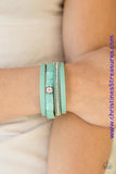 Green leather strands layer across the wrist. Infused with silver chain and white rhinestone accents, green cording knots around a leather strand, securing a solitaire white rhinestone in place for a whimsical finish. Features an adjustable clasp closure. Sold as one individual bracelet.  P9DI-URGR-034XX