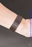 Delicately hammered in shimmery textures, antiqued copper plates are threaded along stretchy elastic bands, creating an indigenous look around the wrist. Sold as one individual bracelet.  P9IN-CPXX-067XX