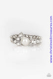 A dainty white pearl is pressed into an abstract white rhinestone encrusted band for a timeless twist. Features a dainty stretchy band for a flexible fit. Sold as one individual ring.  P4DA-WTXX-085XX