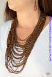 Brushed in an icy metallic shimmer, countless strands of copper seed beads drape across the chest in a bold fashion. Featuring a collision of shapes and shimmer, the glittery strands connect to two large copper accents for a flashy finish. Features an adjustable clasp closure. Sold as one individual necklace. Includes one pair of matching earrings.   P2SE-CPXX-089XX