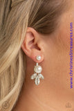 A solitaire white pearl attaches to a double-sided post, designed to fasten behind the ear. Infused with an oversized pearl and white rhinestone fringe, the double sided-post peeks out beneath the ear for a glamorous finish. Earring attaches to a standard post fitting. Sold as one pair of double-sided post earrings.  P5PO-WTXX-211XX
