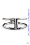 Brushed in a high-sheen shimmer, geometric gunmetal frames curl around the wrist, creating a tribal inspired cuff. Features a hinged closure. Sold as one individual bracelet.  P9SE-BKXX-182XX