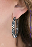 BLOCKBUSTER PIECE The front facing surface of a chunky gunmetal hoop is dipped in brilliantly sparkling hematite rhinestones while light-catching texture wraps around the back. The interior of the hoop features the opposite pattern, creating the illusion of a full hoop of blinding shimmer. Earring attaches to a standard post fitting. Hoop measures 1 3/4" in diameter. Sold as one pair of hoop earrings. P5HO-BKXX-001XX