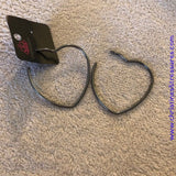 Brushed in a high sheen finish, a glistening gunmetal bar curves into an oversized heart frame for a charming look. Earring attaches to a standard post fitting. Hoop measures approximately 2 3/4" in diameter. Sold as one pair of hoop earrings. P5HO-BKXX-134XX