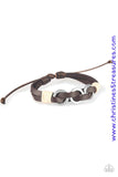 Infused with white twine cording, antiqued silver rings are threaded along strands of brown leather bands for a rustic look. Features an adjustable sliding knot closure. Sold as one individual bracelet.  P9UR-BNXX-397XX