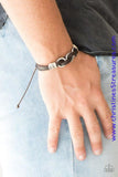 Infused with white twine cording, antiqued silver rings are threaded along strands of brown leather bands for a rustic look. Features an adjustable sliding knot closure. Sold as one individual bracelet.  P9UR-BNXX-397XX