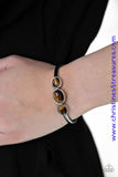 Glowing Tiger's Eye stones are encrusted across the middle of a dainty silver cuff for a seasonal flair. As the stone elements in this piece are natural, some color variation is normal. Sold as one individual bracelet.  P9SE-BNXX-116XX