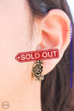 Encrusted in dainty topaz rhinestones, leafy brass frames bloom from a brass rosebud center, creating a feminine floral frame. Earring attaches to a standard clip-on fitting. Sold as one pair of clip-on earrings.  P5CO-BRXX-007XX