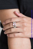 White rhinestone encrusted frames and shiny silver frames link across the finger, coalescing into an airy band. A glittery pink rhinestone is pressed into the center of the band for a glamorous finish. Features a stretchy band for a flexible fit. Sold as one individual ring.  P4RE-PKXX-179XX