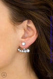 A solitaire white rhinestone attaches to a double-sided post, designed to fasten behind the ear. Encrusted in dazzling white rhinestones, the double-sided post peeks out beneath the ear, creating a glittery fringe. Earring attaches to a standard post fitting. Sold as one pair of double-sided post earrings. P5PO-WTXX-113XX
