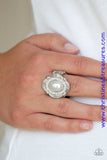 A pearly white bead is pressed into an ornate silver frame radiating with a ring of glassy white rhinestones, creating a timeless centerpiece atop the finger. Features a stretchy band for a flexible fit. Sold as one individual ring.  P4RE-WTXX-357XX